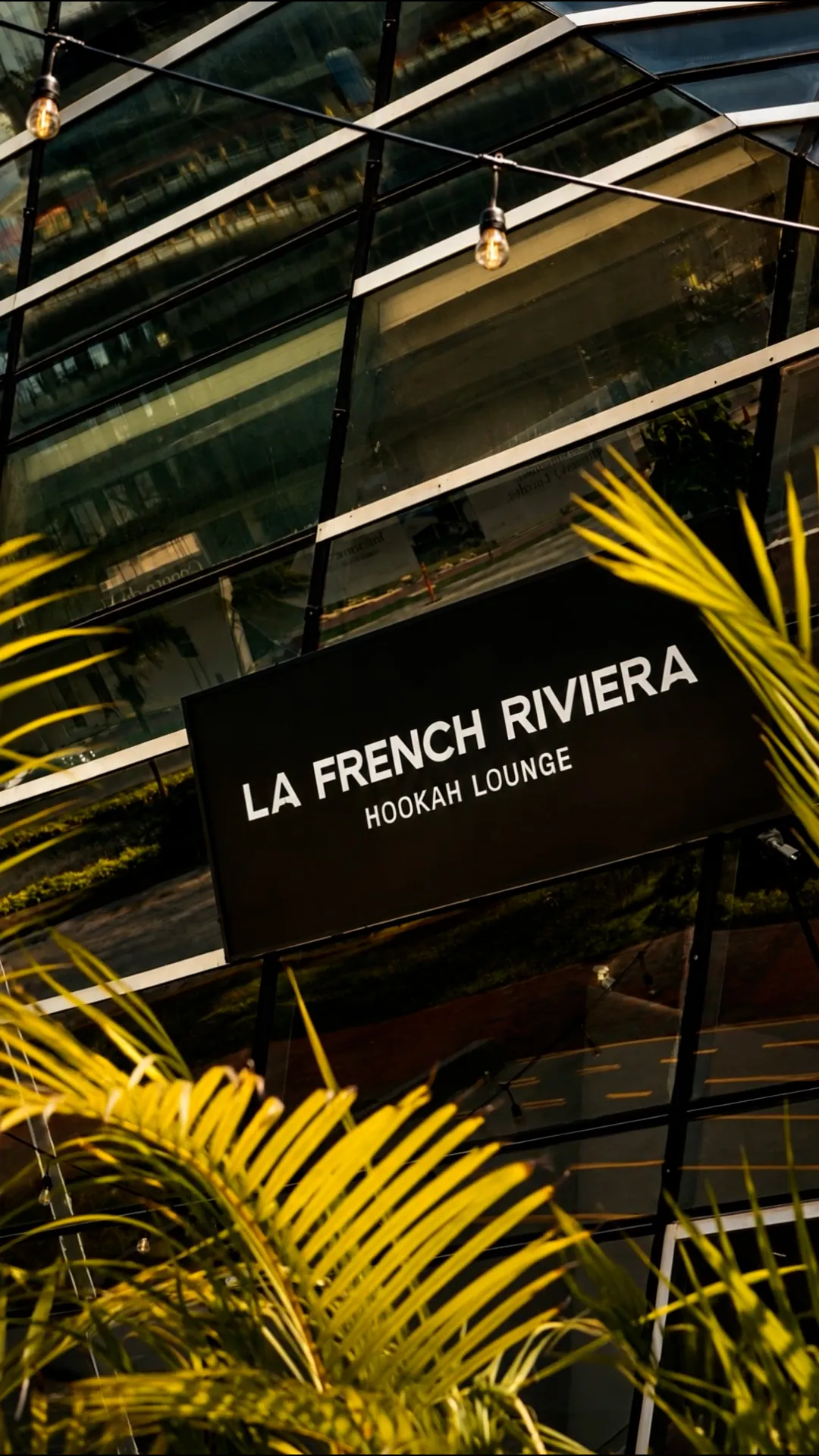 La French Riviera Hookah Lounge sign in Cancún